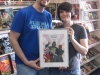 Rod and Leanne with charity art for 11 year old Morgan